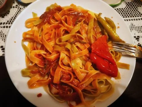 Pasta with Tomato Sauce on a Table 库存照片