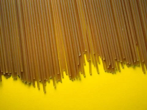 Pasta of two types on the table.  buckwheat spaghetti. Italian food. Long pas Stock Photos