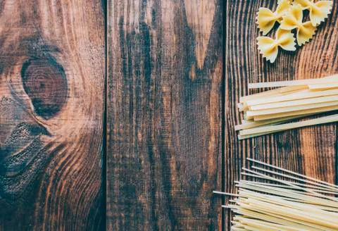 Pasta on the wood rustic kitchen table Stock Photos