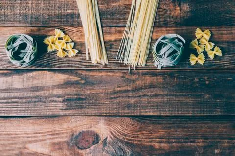 Pasta on the wood rustic kitchen table Stock Photos