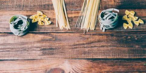Pasta on the wood rustic kitchen table Stock Photos