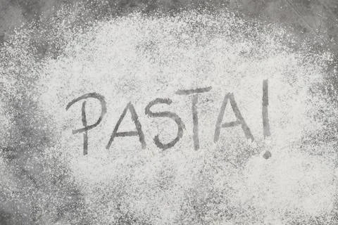 Pasta word write in flour on a stone background Stock Photos