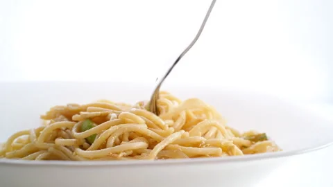 Pasta with zucchini can be wrapped around a fork and eaten. Video stock 287257337