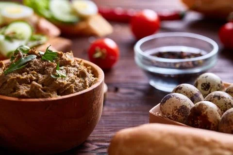 Paste from chicken liver with vegetables and quail eggs, shallow depth of field Stock Photos