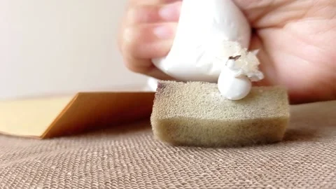 Paste a white glue on a spons Stock Footage 145674773