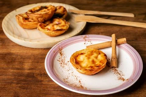 Pasteis de nata,a typical sweet from Lisbon, Portugal, a cake on a plate, s.. Stock Photos