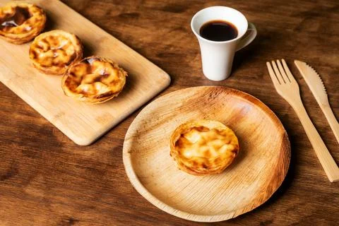 Pasteis de nata, a typical sweet from Lisbon, Portugal, a cake on a plate n.. Stock Photos