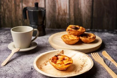 Pasteis de nata, a typical sweet from Lisbon, Portugal, a cake on a plate n.. Stock Photos