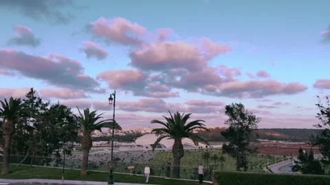 Pastel Cloud Sunset Over the Bouregreg River and Palm Trees, Rabat, Morocco Stock Footage 303966485