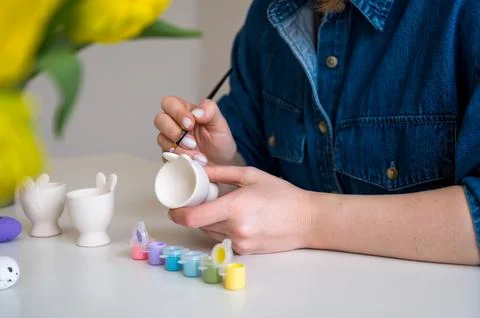 Pastel color Easter egg holder. Woman preparing for spring holiday Stock Photos