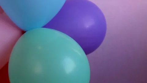 Pastel colored balloons on pink background 動画素材 70144604