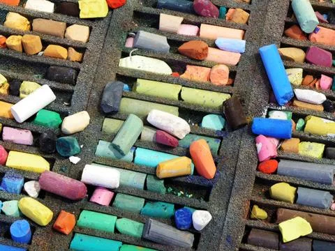 Pastel colored crayons in a box Stock Photos