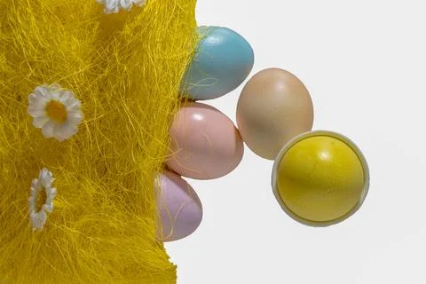 Pastel colored easter egg assortment in white cups Stock Photos