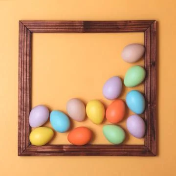 Pastel colored Easter eggs on yellow Foto stock