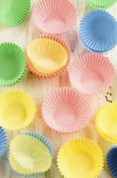 Pastel colored empty cupcake cases Stock Photos