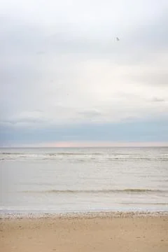 Pastel colored sunset at a beach Фото
