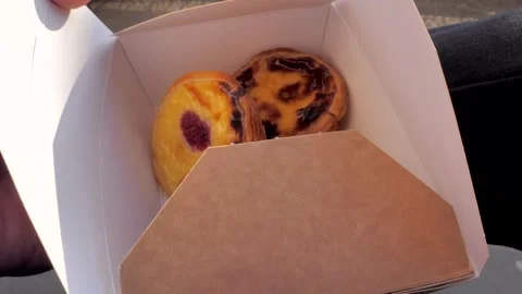 Pastel de belem box - the perfect travel snack in Europe, Portugal Stock Footage 305603769