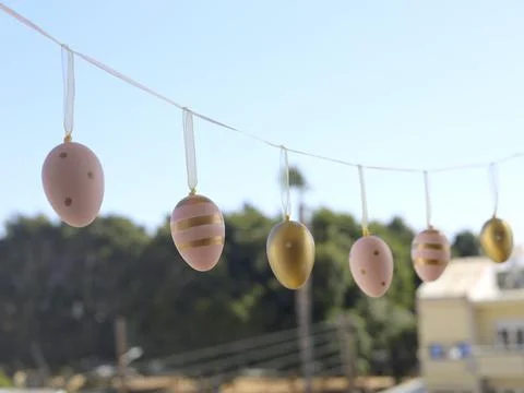 Pastel Easter Egg Garland Hanging Outdoors Stock Photos