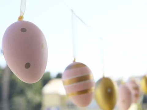 Pastel Easter Egg Garland In Soft Sunlight Stock Photos