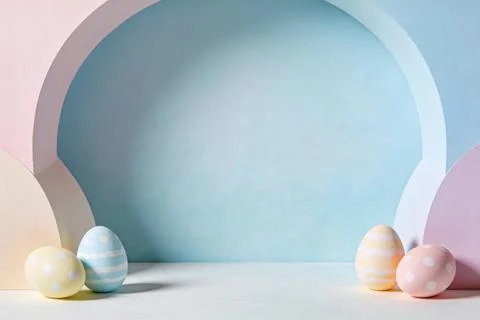 Pastel Easter eggs arranged in a soft, dreamy studio setting with arched ba.. Stock Photos