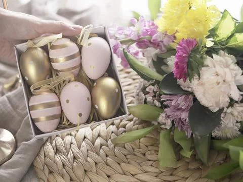 Pastel Easter Eggs Beside Fresh Spring Flowers Stock Photos