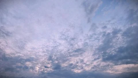 Pastel Evening Sky with Layered Clouds. Nature Background Stock Photos