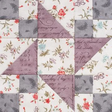 Pastel geometric patchwork block from pieces of fabrics, detail of quilt Foto stock