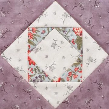 Pastel geometric patchwork block from pieces of fabrics, detail of quilt Fotos de archivo