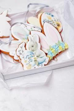 Pastel gift box with Easter decorated glazed cookies. Spring cozy aesthetics Stock Photos