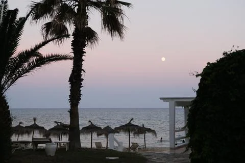 Pastel gradient sky after sunset on the beach in Hammamet ,Tunisia Stock Photos