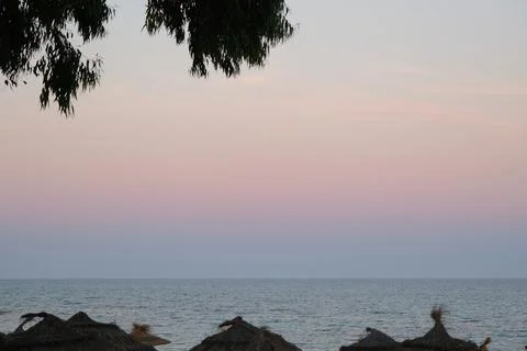 Pastel gradient sky after sunset on the beach in Hammamet ,Tunisia Stock Photos