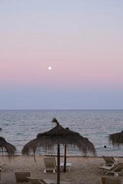 Pastel gradient sky after sunset on the beach in Hammamet ,Tunisia Stock Photos
