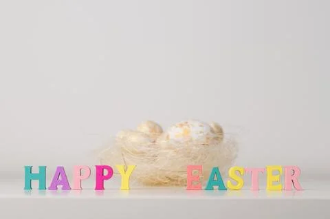Pastel happy easter banner with eggs in the background. Stock Photos