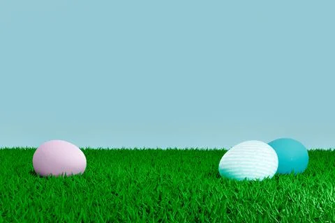 Pastel painted easter eggs on grassy field with blue sky background and negat Stock Illustration