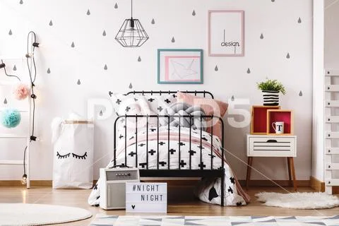 Pastel pillows on girl's bed Stock Photos