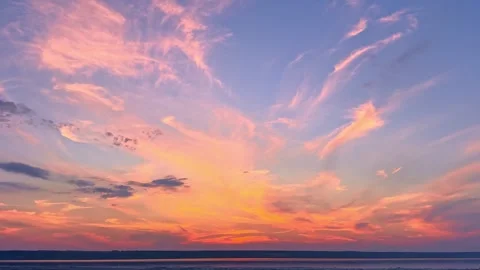 Pastel Pink Clouds and Sunset Reflection on Water Stock Footage 344818797