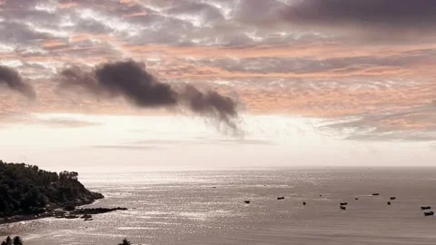 Pastel Pink Clouds Over Sparkling Ocean Coastline with Fishing Boats Stock-Footage 320034645