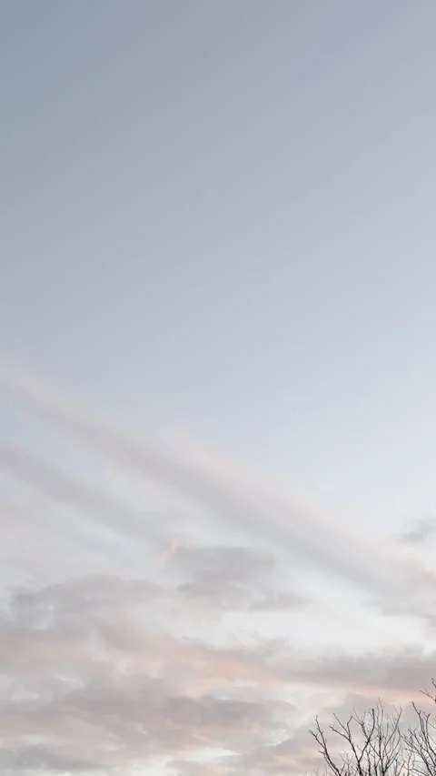 Pastel Pink Clouds Stretching Across Blue Evening Sky Video stock 344717328