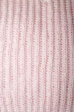 Pastel pink knitting pattern, woolen yarn texture with braid design surface Stock Photos