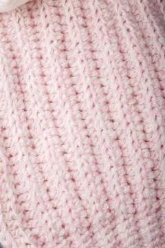Pastel pink knitting pattern, woolen yarn texture with braid design surface Stock Photos