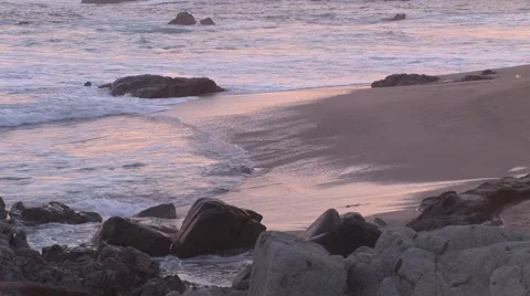 Pastel Reflections As Waves Wash Onto Beach Stock-Footage 1014404