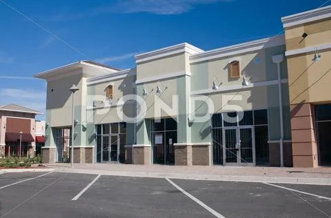 Pastel retail strip mall brick accents Stock Photos