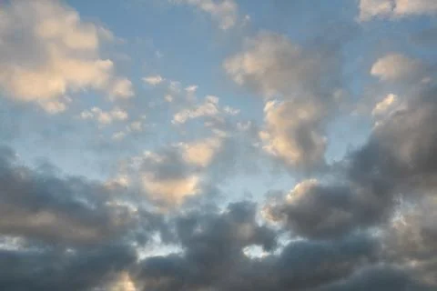 Pastel sky texture with cumulus clouds Stock Photos