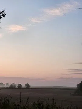 Pastel soft gradient of evening sky during peaceful sunset Stock Photos
