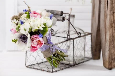 Pastel spring bouquet in rustic composition Stock Photos