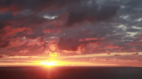 Pastel Sunset over the ocean, sun framed left Stock Footage 82002206