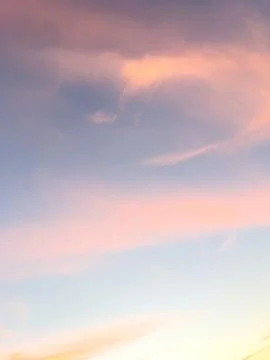 Pastel Sunset Sky with Soft Clouds Stock Photos