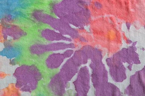 Pastel tie dye, a handmade pattern on a cotton t-shirt. Close-up, top view. D Stock Photos