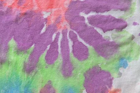 Pastel tie dye, a handmade pattern on a cotton t-shirt. Close-up, top view. D Stock Photos