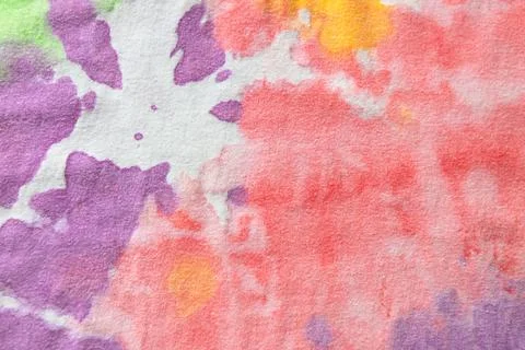 Pastel tie dye, a handmade pattern on a cotton t-shirt. Close-up, top view. D Foto stock